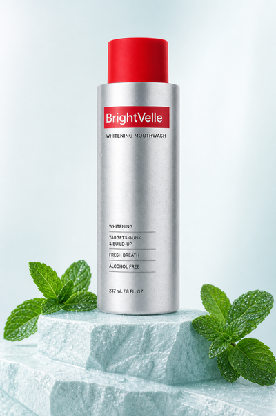 BrightVelle mouthwash bottle with fresh mint on an icy-teal pedestal