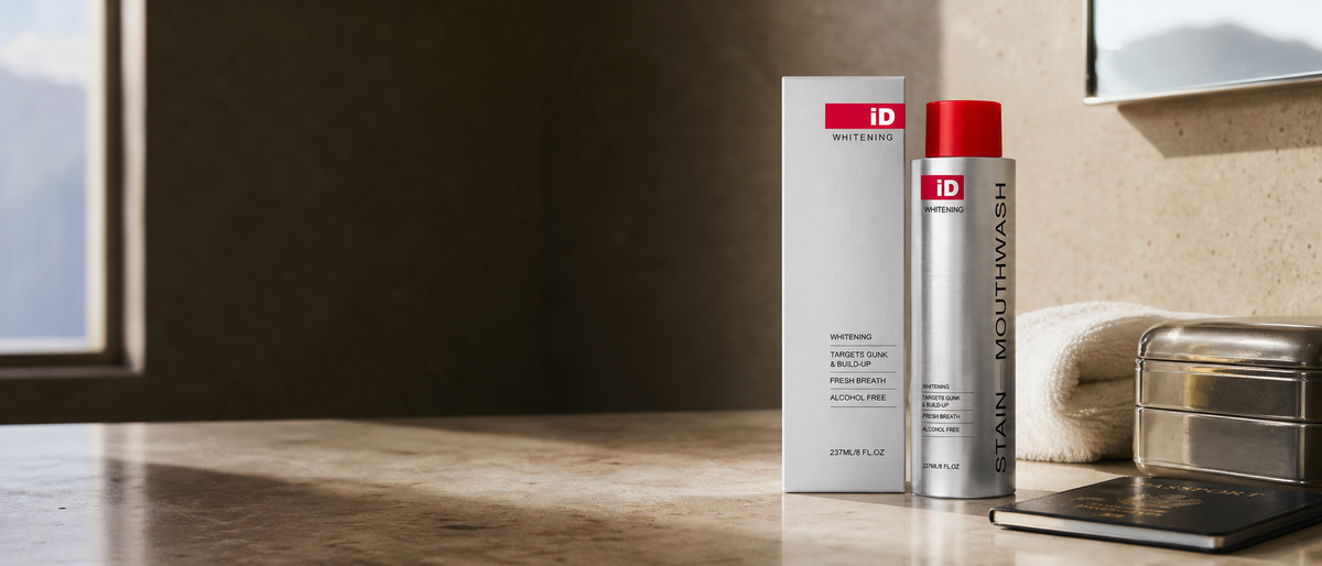 Ultra-wide travel toiletry scene with the original iD metal mouthwash