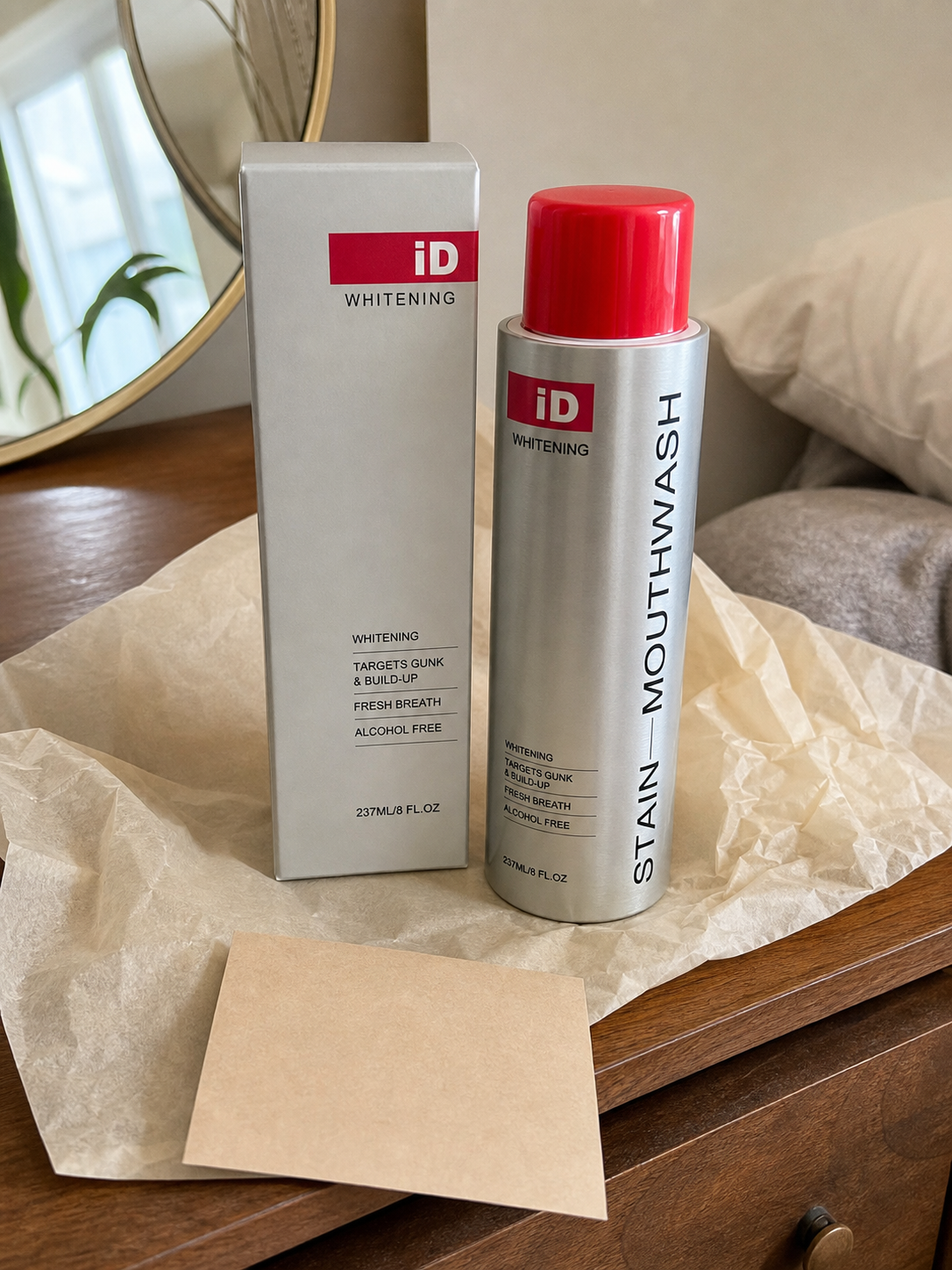 UGC-style original iD mouthwash bottle and premium carton
