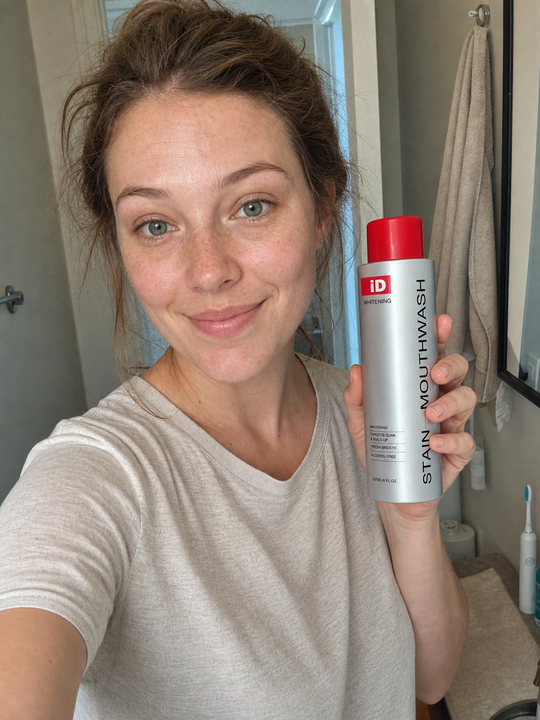 UGC-style customer selfie holding original iD mouthwash