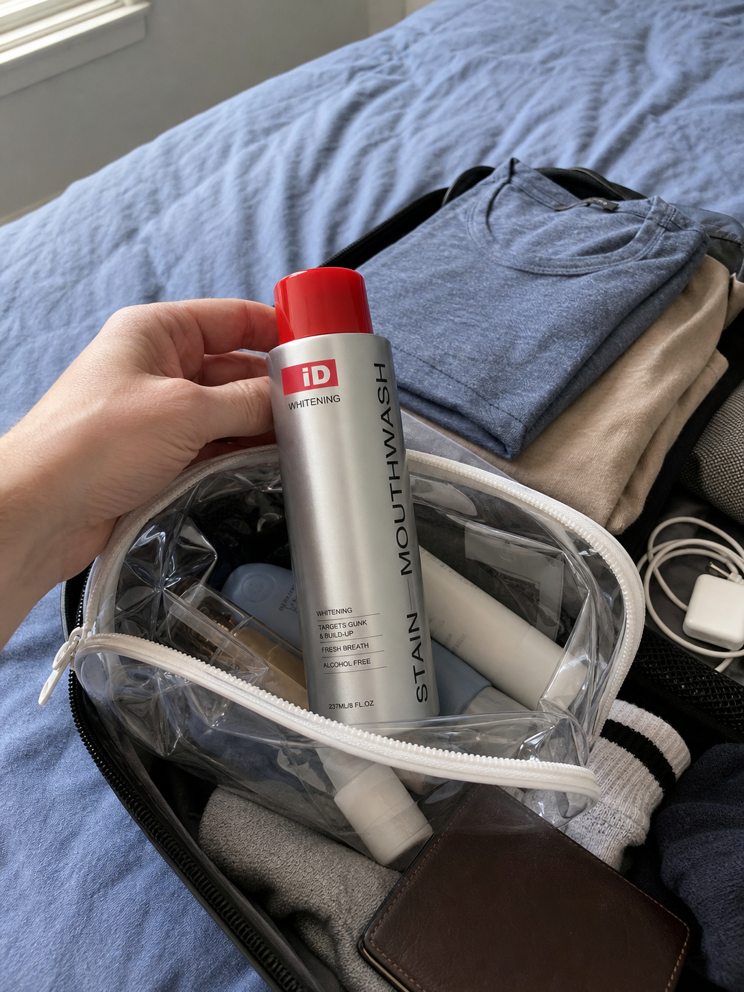 UGC-style travel packing photo with original iD mouthwash